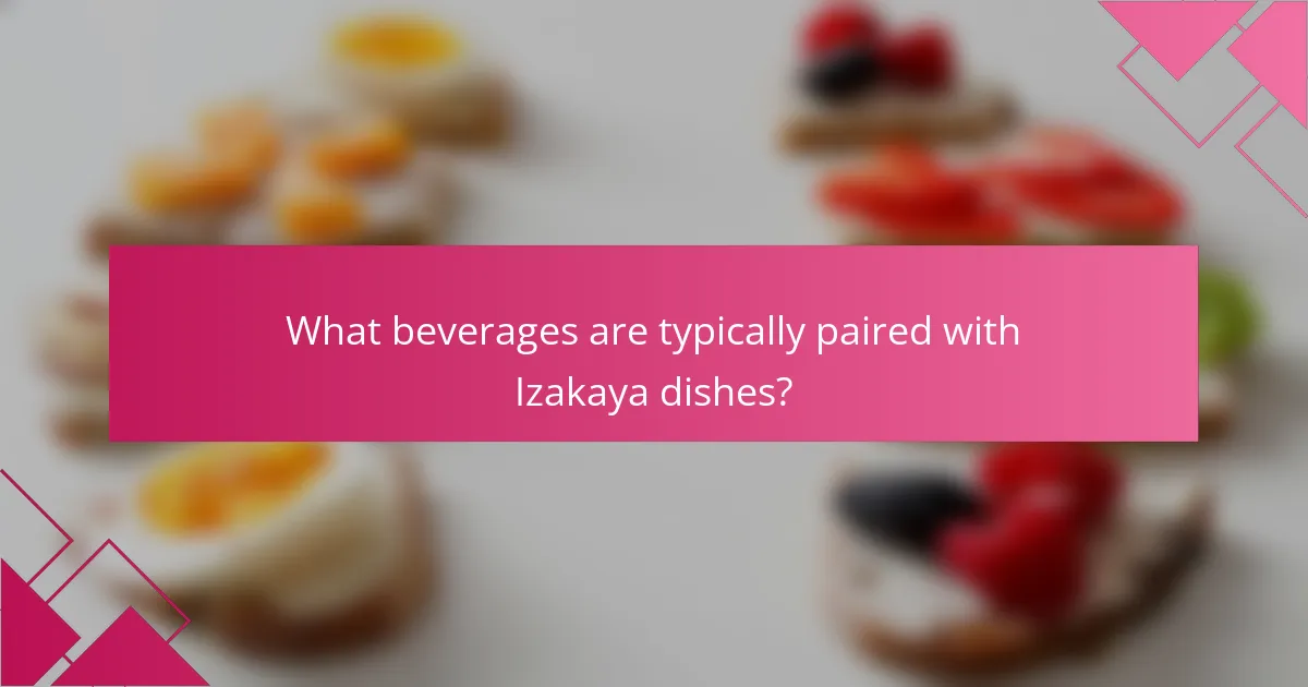 What beverages are typically paired with Izakaya dishes?